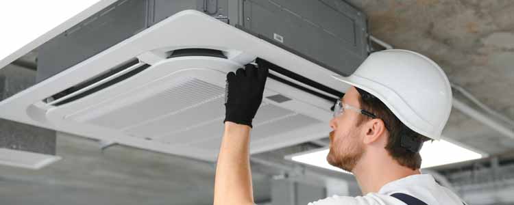 Tech inspecting Indoor AC Vent