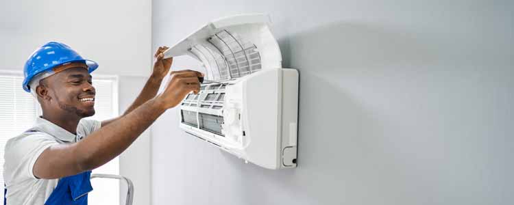 Tech maintaining a split system